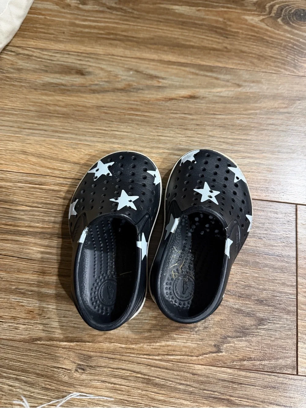 Native Shoes Black Slip-On Water Shoes with White Star Accents